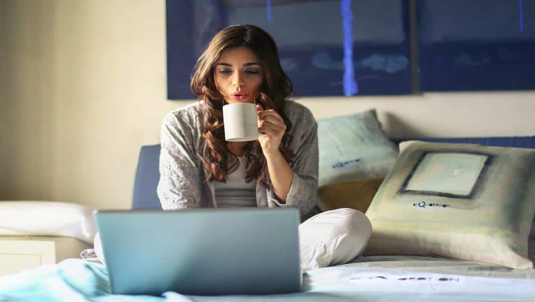 Women-with-Grey-Jacket-Working-with-Laptop