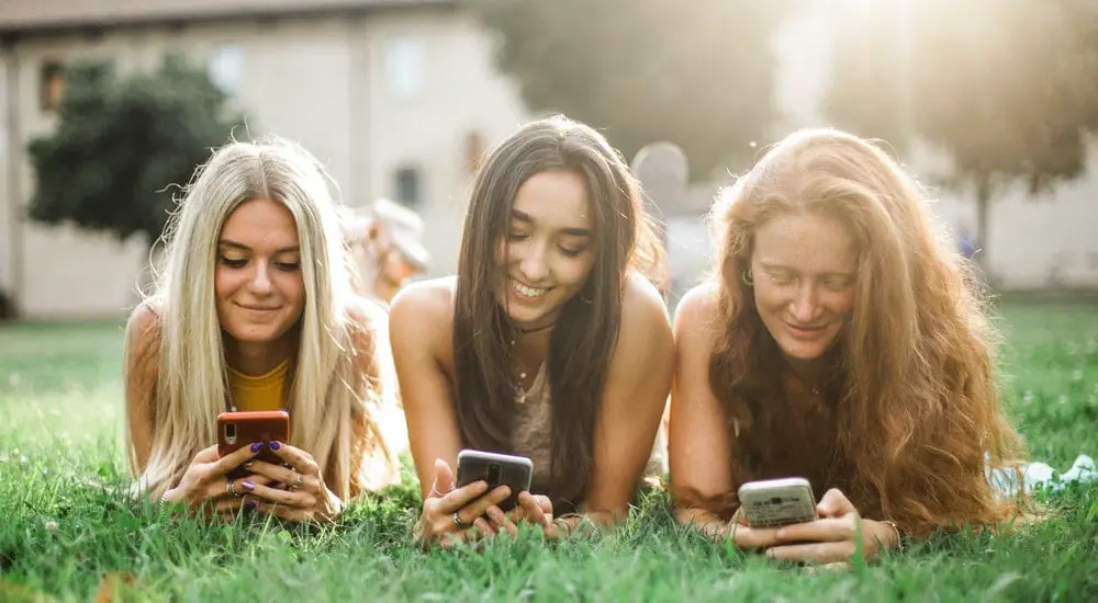 Female Friends Browsing Smartphones