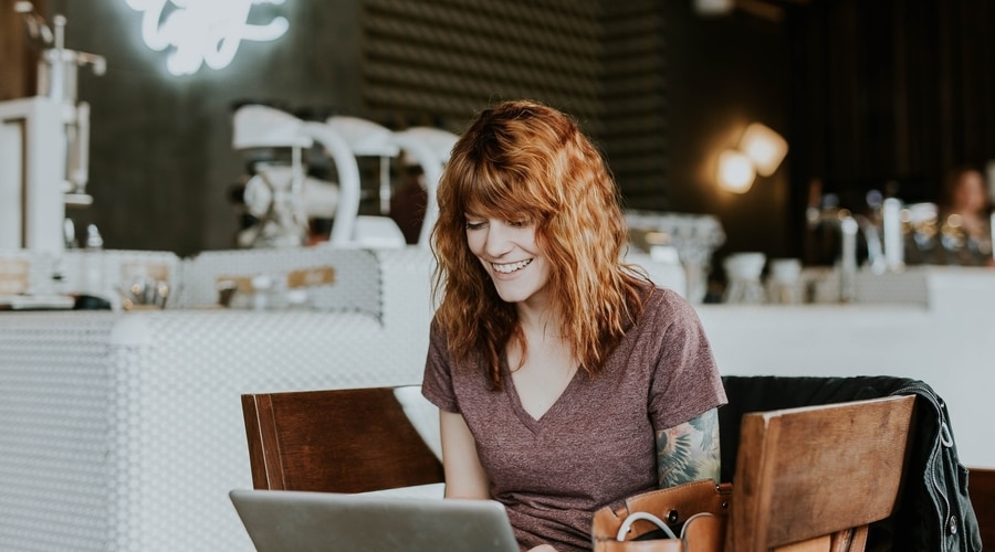 Tattooed Woman with Laptop